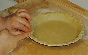 Fluting the pie crust edge